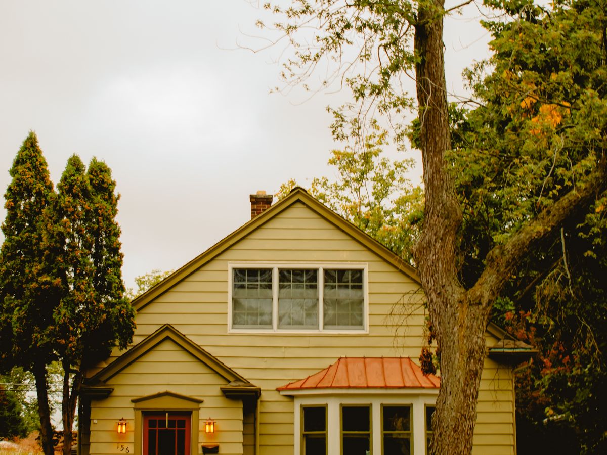 Cottage-style home set among mature trees