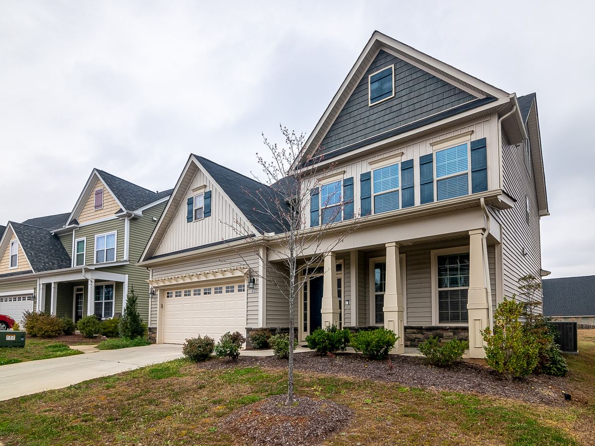 Row of similar two-story homes in a residential neighborhood